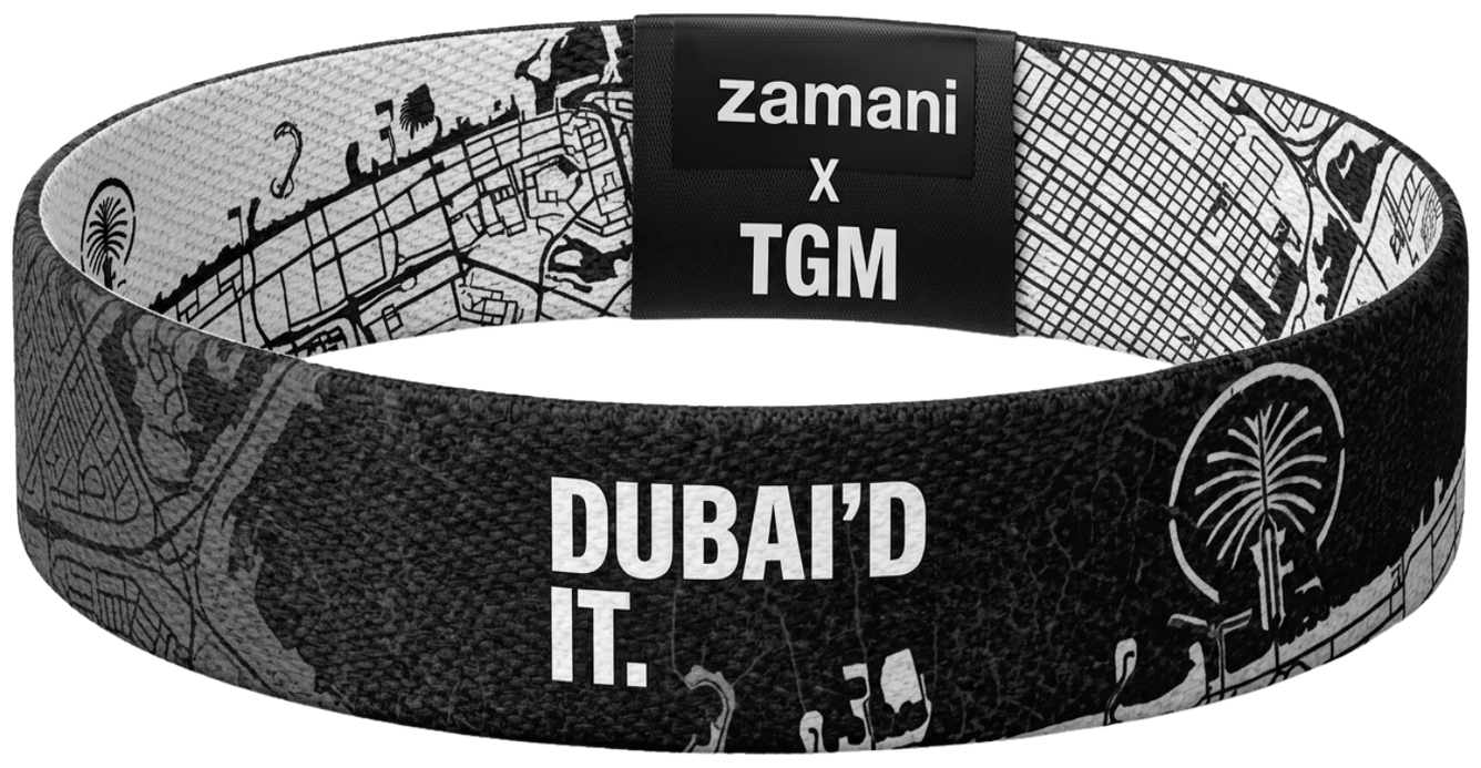 The reversible DUBAI’D IT wristband, black side out, Dubai map woven through it
